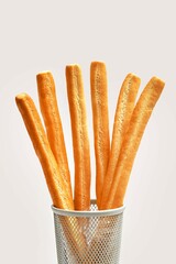 italian stick bread grissini, Breadsticks in a glass on a white background