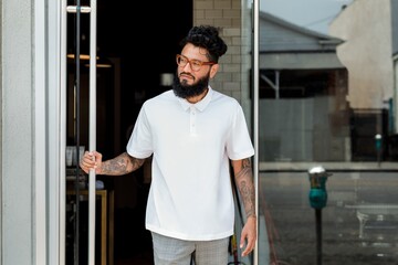 Bearded man in white polo shirt, men’s casual apparel fashion