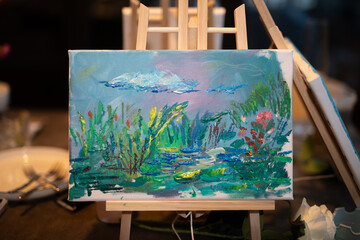 artist easel with brushes