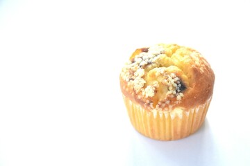blueberry muffin topping sugar in paper on white background