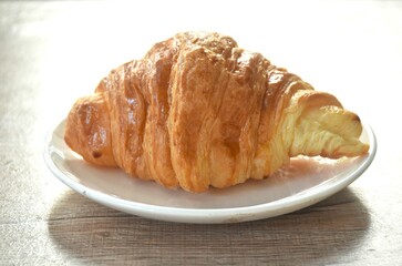 baking crispy butter croissant French bread on plate