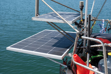 Solar panels on the stern of a sailboat. This means that the ship is always provided with free...