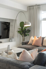 Tasteful Minimalism: Cozy Contemporary Living Room with Chic Grey & Blush Accents