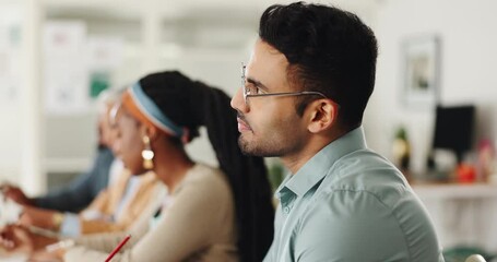 Business people, meeting and writing notes in team, training or watch video for development in career. Men, women and listening to tutorial with notebook, coaching or studying at creative workplace