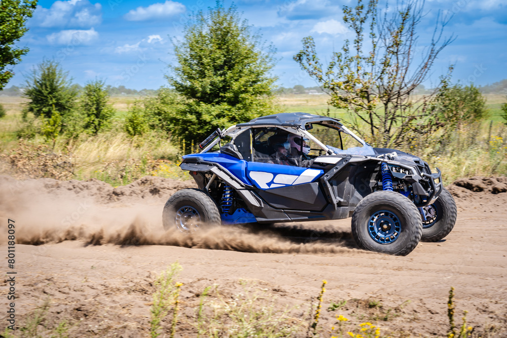 Poster UTV buggy moves on dusty road. 4x4, extreme, adrenalin.