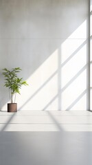 a plant in a pot on a ledge in front of a wall with a large window to the right