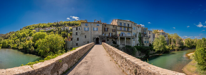 Sauve, France - 04 16 2024: Panoramic View of the Village and the river from the Old Bridge Gate.