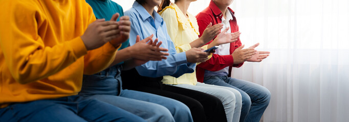 Group of startup company employee gather in line at corporate event to applaud achievement and...