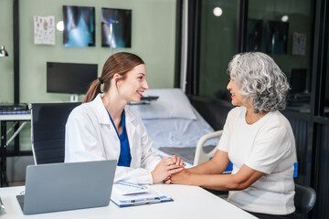 Monthly health check-ups and counseling sessions are provided to an elderly Asian woman by a...