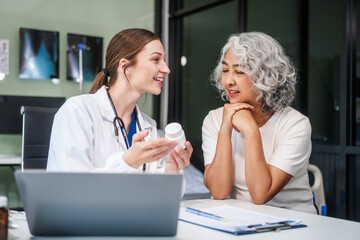 Monthly health check-ups and counseling sessions are provided to an elderly Asian woman by a...