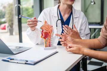 Caucasian woman and elderly Asian woman discuss health issues cold, influenza, pneumonia,...