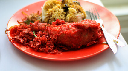 Nasi Kandar with red fried chicken as a side dish