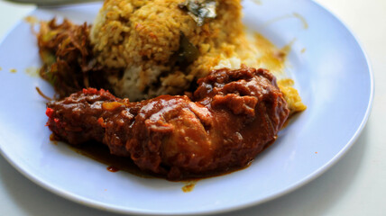 Nasi Kandar with red fried chicken as a side dish