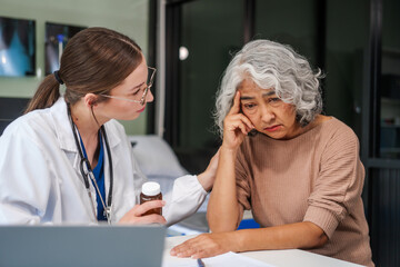 Caucasian female psychiatrist sits at her desk, providing mental health consultations and therapy...