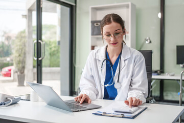 Caucasian female psychiatrist sits at her desk, providing mental health consultations and therapy...