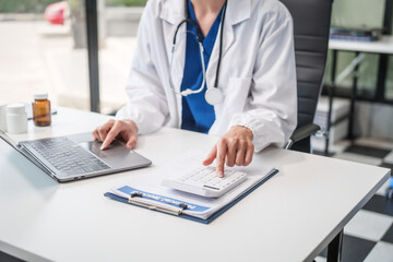 Caucasian female psychiatrist sits at her desk, providing mental health consultations and therapy...