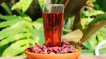 a glass of roselle tea. herbal drink for health