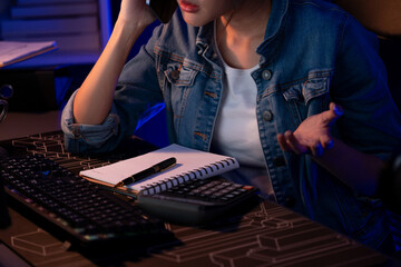 Cropped image of young Asian creative woman calling on phone to customer or coworker for marketing...