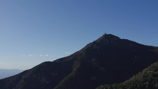 Aerial of an observatory on a mountain summit