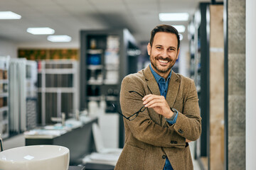 Portrait of a male worker, posing for the camera, working as a salesman at the home design store.