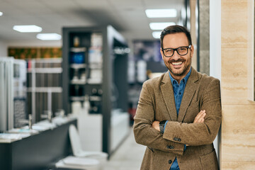 Portrait of a smiling male working as a salesman at the home design shop.