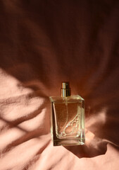 perfume bottle on a pink background
