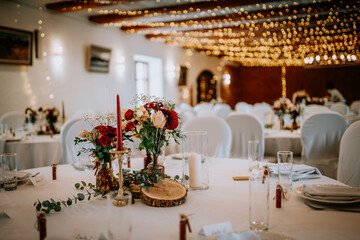 Valmiera, Latvia - August 19, 2023 - Elegant wedding reception setup featuring beautifully arranged...