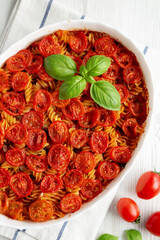 Homemade Easy Tomato Basil Pasta Bake, overhead view. From above, flat lay, top view.