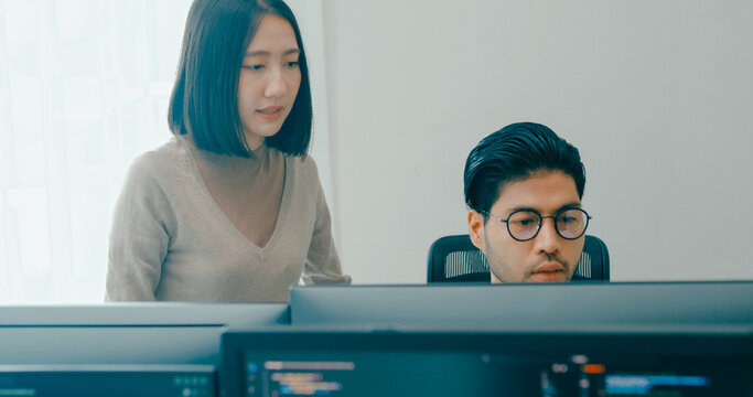 Group Adult Asia male, female freelance meeting write prompt AI bot IT app smart program nomad, video game, talk strategy, discuss plan, user interface, designer, big data center on desktop computer.