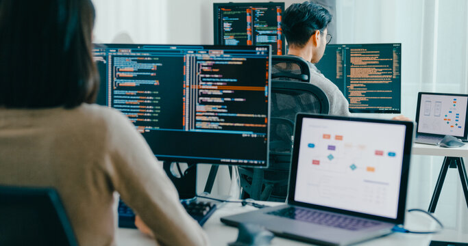 Closeup Adult Asia male, female freelance typing write prompt AI bot IT app smart program nomad, video game, terminal with coding language, user interface, designer, big data center desktop computer.