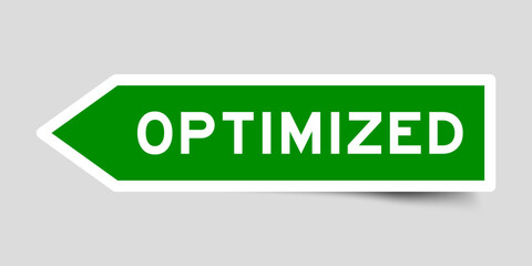 Green color arrow shape sticker label with word optimized on gray background