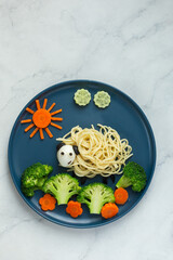 Funny kids food idea, cute sheep made of spaghetti pasta