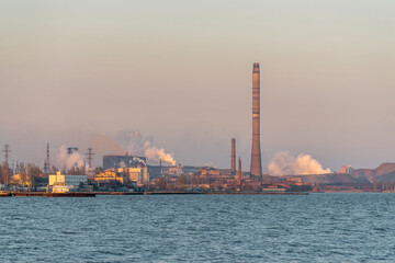 Factory with air pollution smoke from chimneys, environmental problems. Industry air pollution...