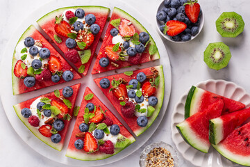 watermelon pizza with yogurt and fresh berries,