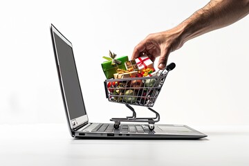 A hand takes goods from a shopping cart against the background of an open laptop Online shopping concept.