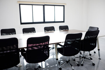 Black chairs in the conference room.