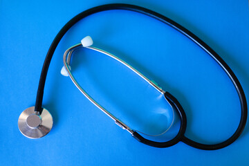 Top view of stethoscope isolated on blue background.Medical concept