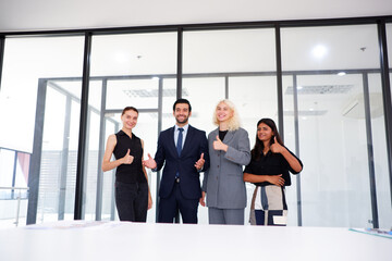 Businessman and businesswoman standing and smiling.