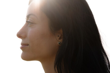 A profile portrait of a beautiful smiling woman