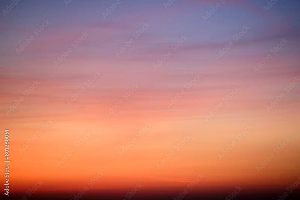 Wall mural the evening sky displayed a stunning array of red and pink clouds