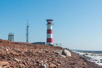 lighthouse on the rocky coast of the White Sea in the north