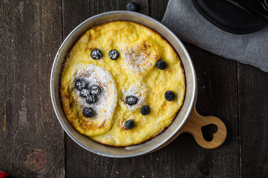 Whole pancake is baked in oven on preheated iron skellet