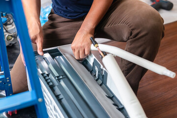 Repairman service for repair and maintenance of air conditioners, Technician team install new air...