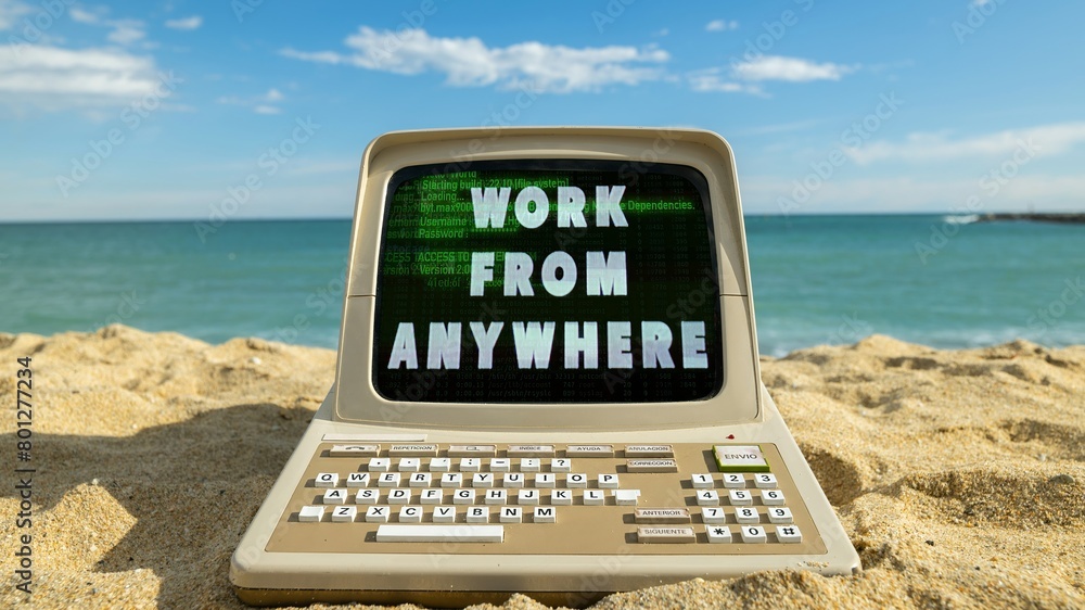 Poster computer on a beach with words work from anywhere on screen
