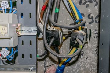 Electricity meters. Electrical panel. Electrical wires. Readings from electrical metering devices.	