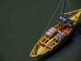 boat with wine barrels ribeira Porto old town street view building, portugal on the Douro River