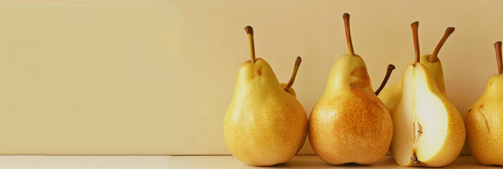 A close up of four pears with one of them cut open