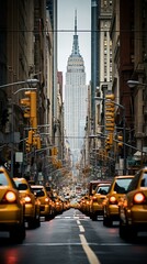 Traffic jam on a busy street in New York City with the Empire State Building in the background