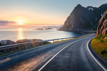 A coastal road in Norway, with the sea on one side and cliffs to another, bathed by the golden...