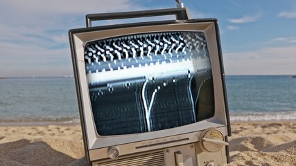 television with glitch next to the sea - 801298846